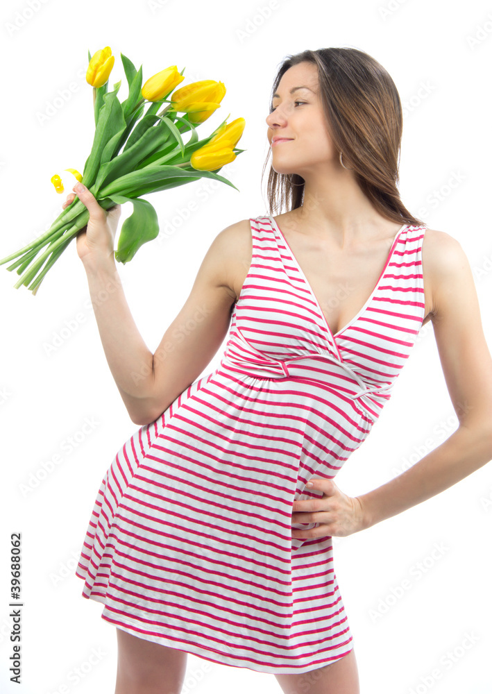 Woman with yellow tulips bouquet of flowers smiling Woman with yellow tulips bouquet of flowers smiling