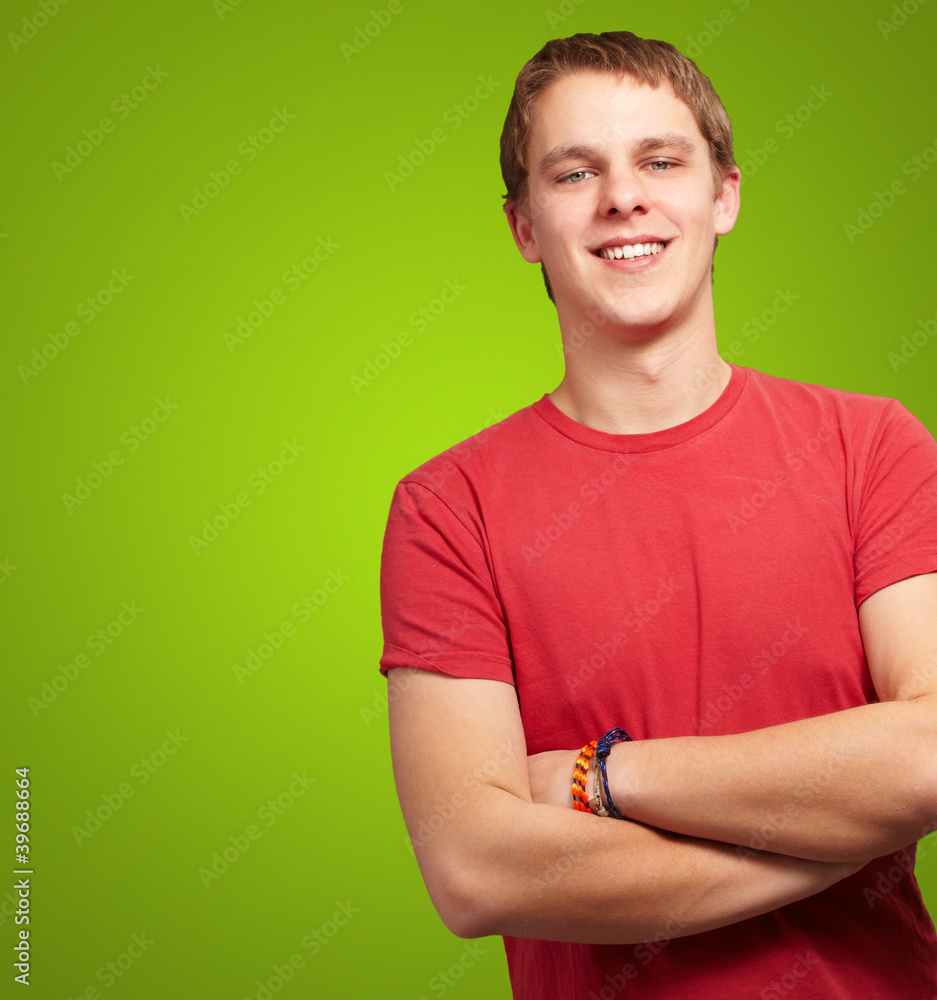 portrait of young man smiling over green background portrait of young man smiling over green background