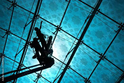 Window cleaners washing glass in sun light