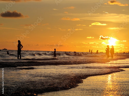 a background image of the beach at sunset
