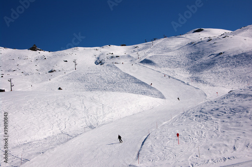 skiers on ski slopes in French Alps © Andrei Kazarov