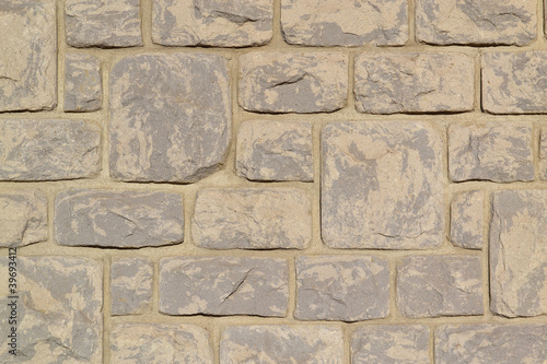 Beige stone wall.