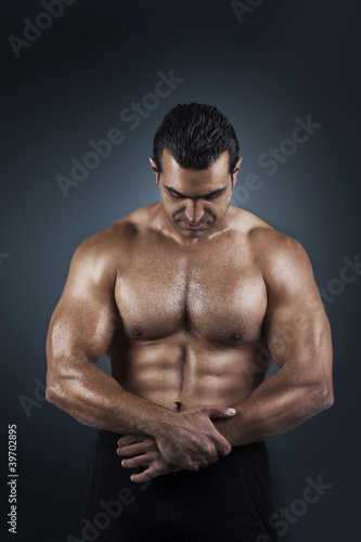 Photo of naked athlete with strong body
