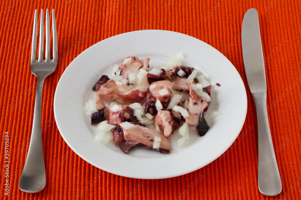 salad with octopus on the white plate salad with octopus on the white plate