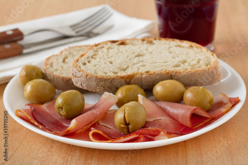 prosciutto with bread on the plate