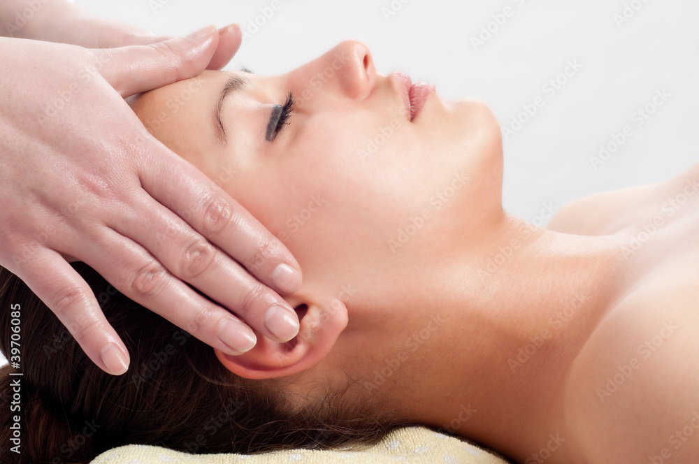 Beautiful young women getting a face massage