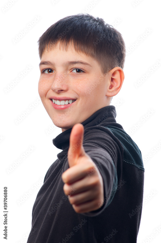 Happy teenage boy showing thumbs up isolated on white Happy teenage boy showing thumbs up isolated on white