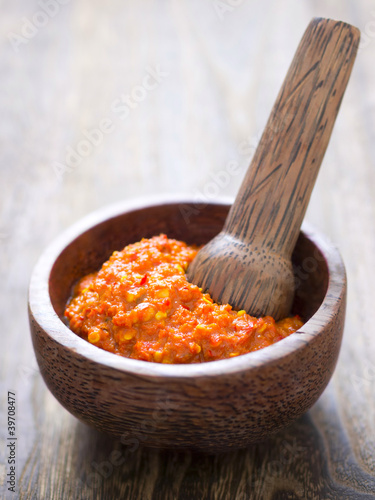 close up of a bowl of fermented shrimp paste photo