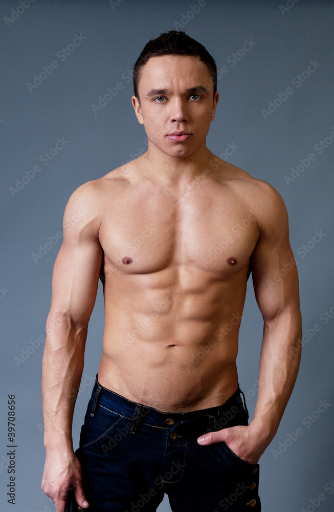 Fototapeta premium Sexy naked torso fit and neat young man studio portrait
