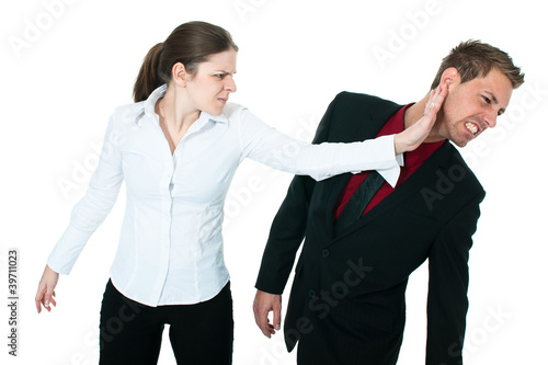 Tableau sur toile angry woman slapping a business man's face