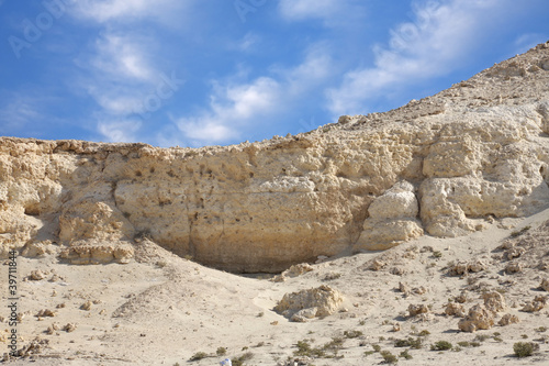 Closeup of beautiful limestone hillock in the desert of Bahrain photo