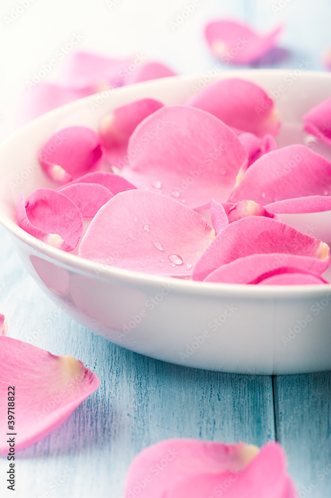 Rose petals in a bowl of water Rose petals in a bowl of water