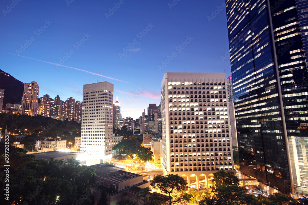 Obraz premium office building at night in hong kong
