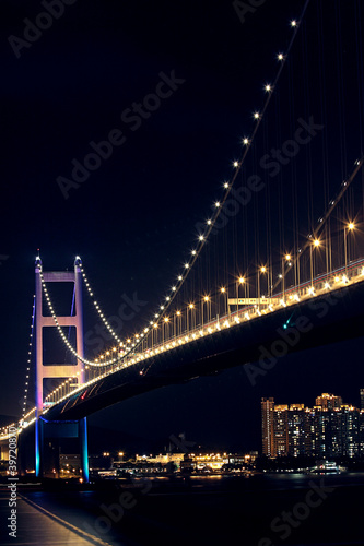 Tsing Ma Bridge in Hong Kong at night © Cozyta