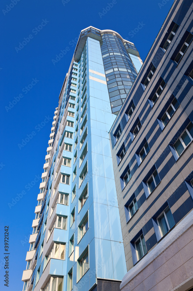Obraz premium Modern skyscraper on blue sky background in Samara, Russia