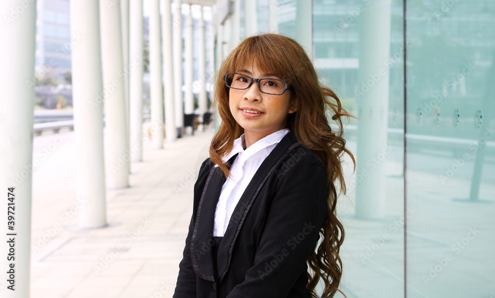 portrait of a young business woman in an office portrait of a young business woman in an office