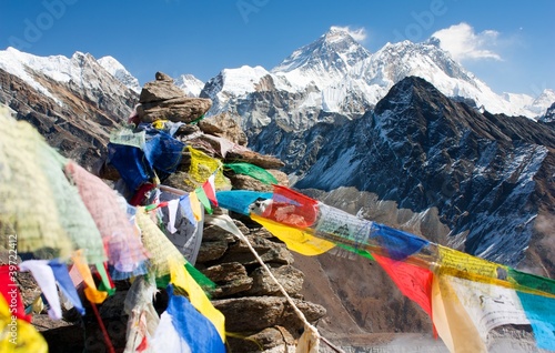 view of everest from gokyo ri with prayer flags