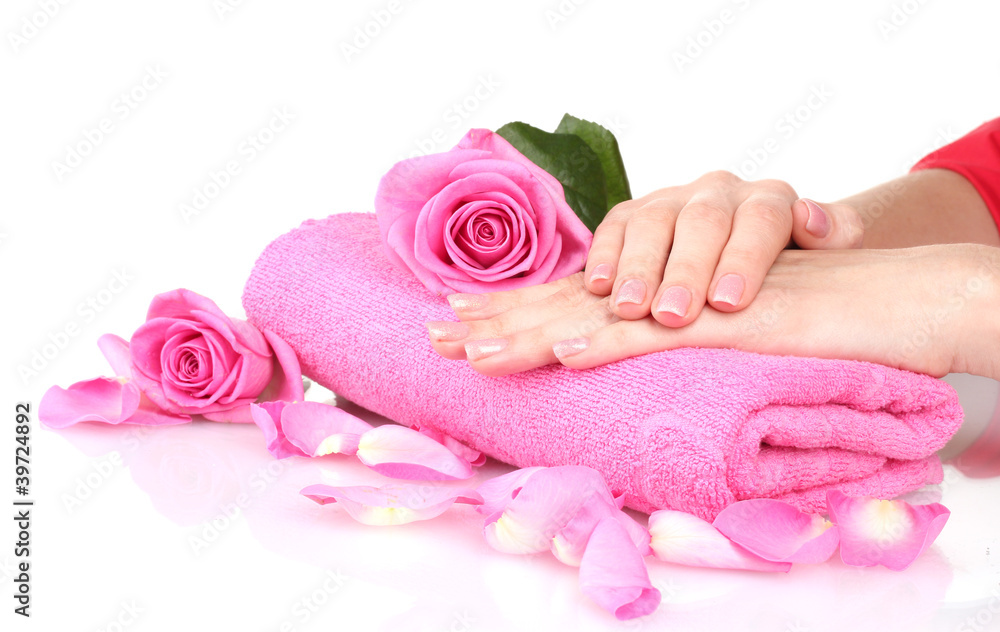 Pink towel with roses and hands on white background