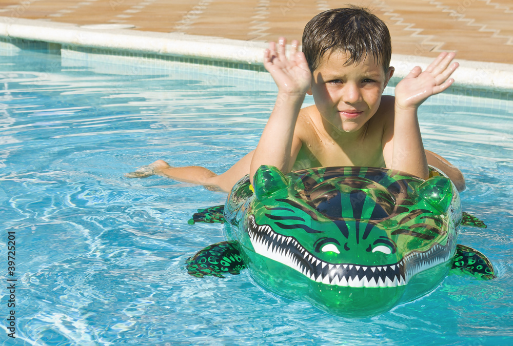 © Rafa Fernandez - Kid playing at the swimming pool