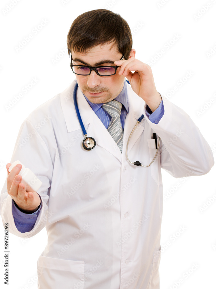 The doctor man holding a container of vitamins The doctor man holding a container of vitamins