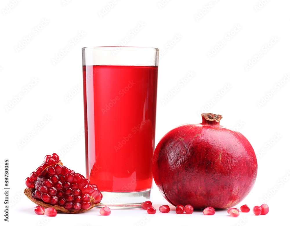 ripe pomergranate and glass of juice isolated on white. ripe pomergranate and glass of juice isolated on white.