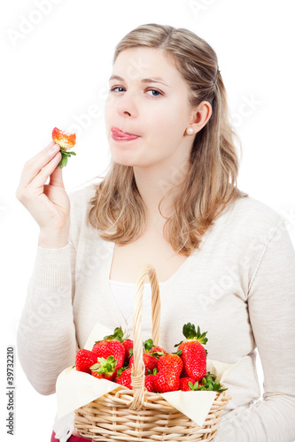 Woman eating fresh strawberries