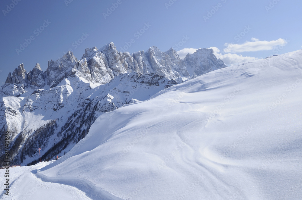 snowy slope and Pale range, dolomites snowy slope and Pale range, dolomites