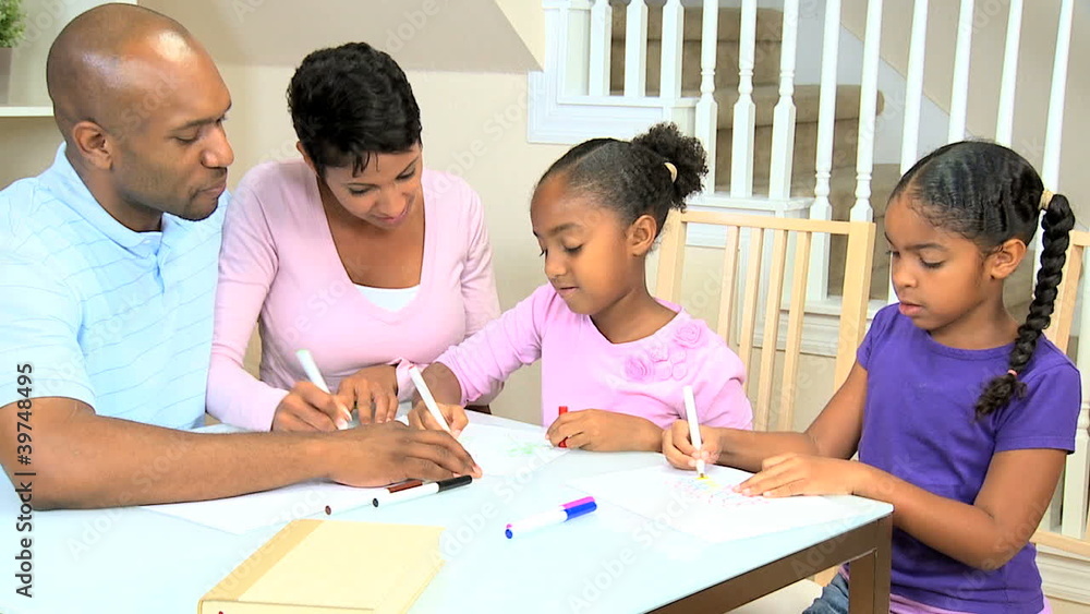 Little African American Girl Reading with her Family Little African American Girl Reading with her Family