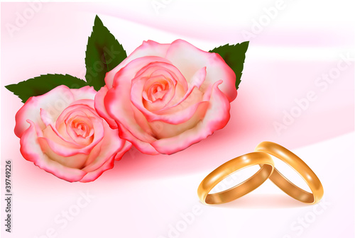 Gold wedding rings in front of three pink roses