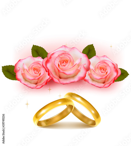 Gold wedding rings in front of three pink roses