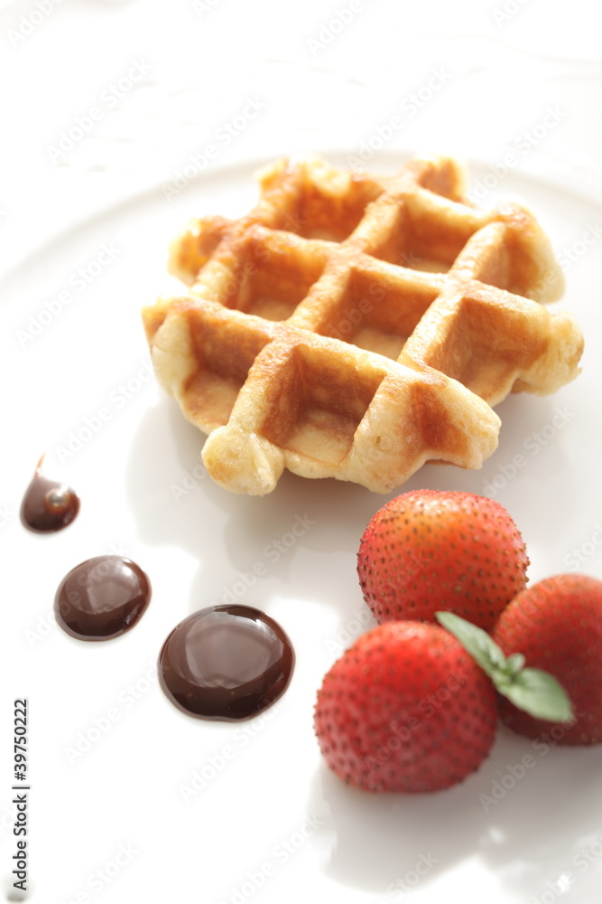 Strawberries and waffle with chocolate sauce Strawberries and waffle with chocolate sauce