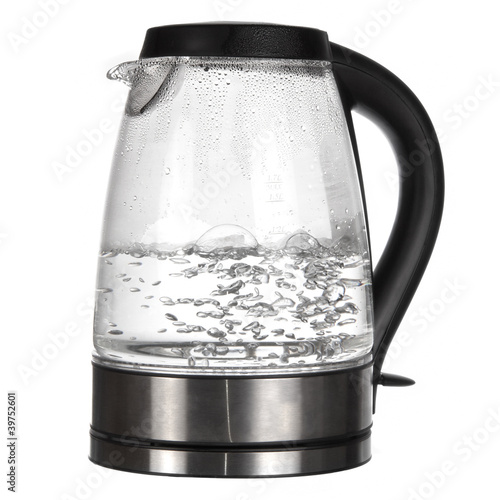 Tea kettle with boiling water isolated on white