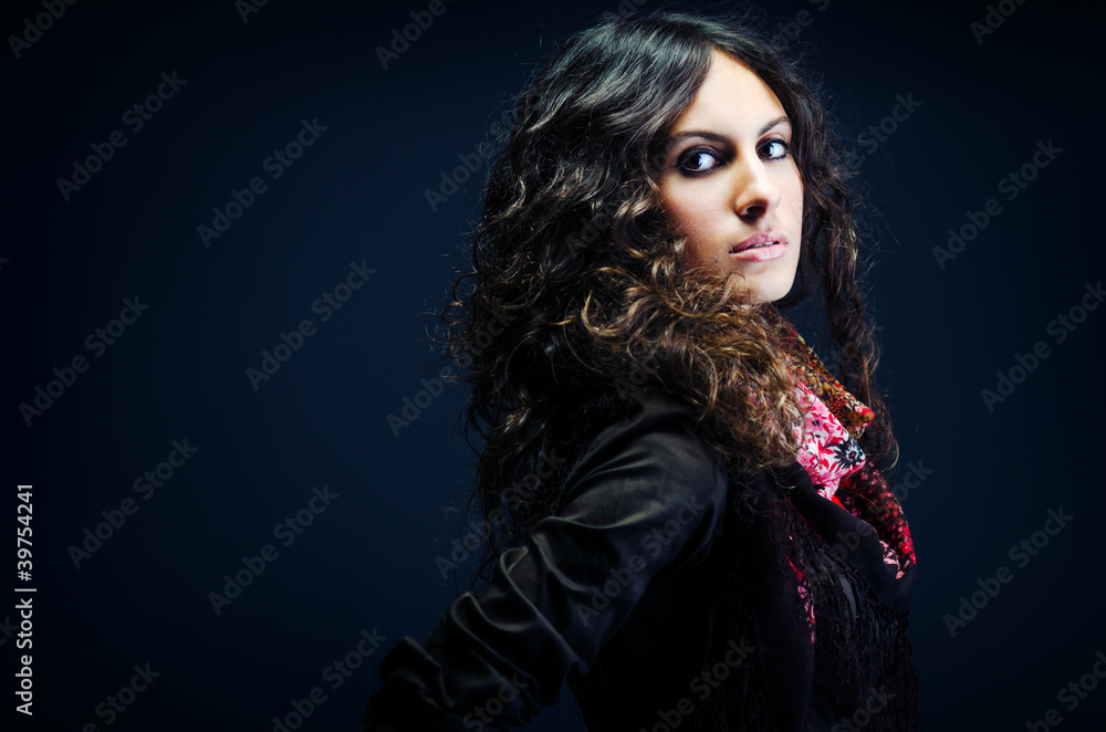 Portrait of a beautiful lady with long curly hair