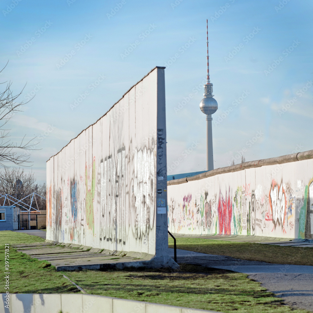 Parts of Berlin Wall with Television Tower in background Stock Photo