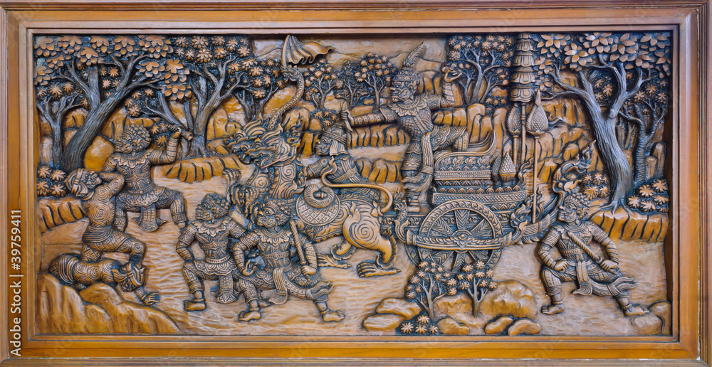 The ramayana epic wood carved on temple wall, Thailand