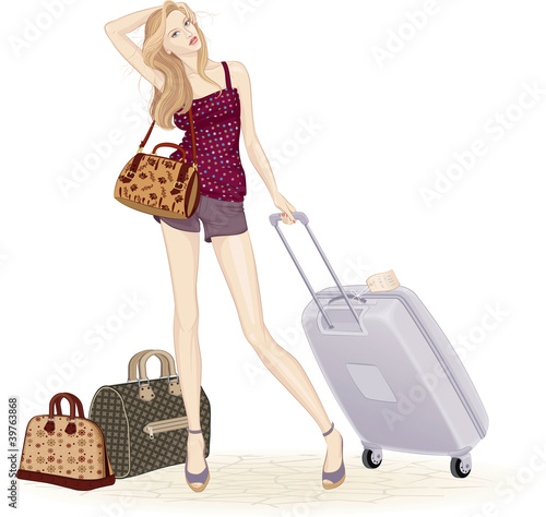 Beautiful young woman standing with suitcase and travel bags