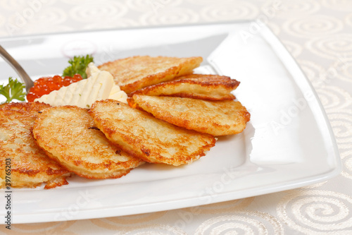 fried potatoes pancakes with caviar