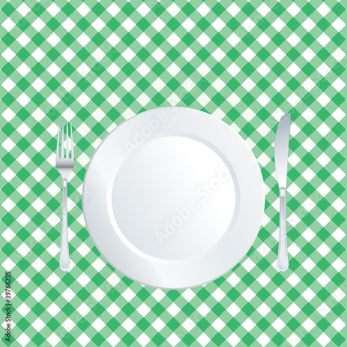 plate on green tablecloth