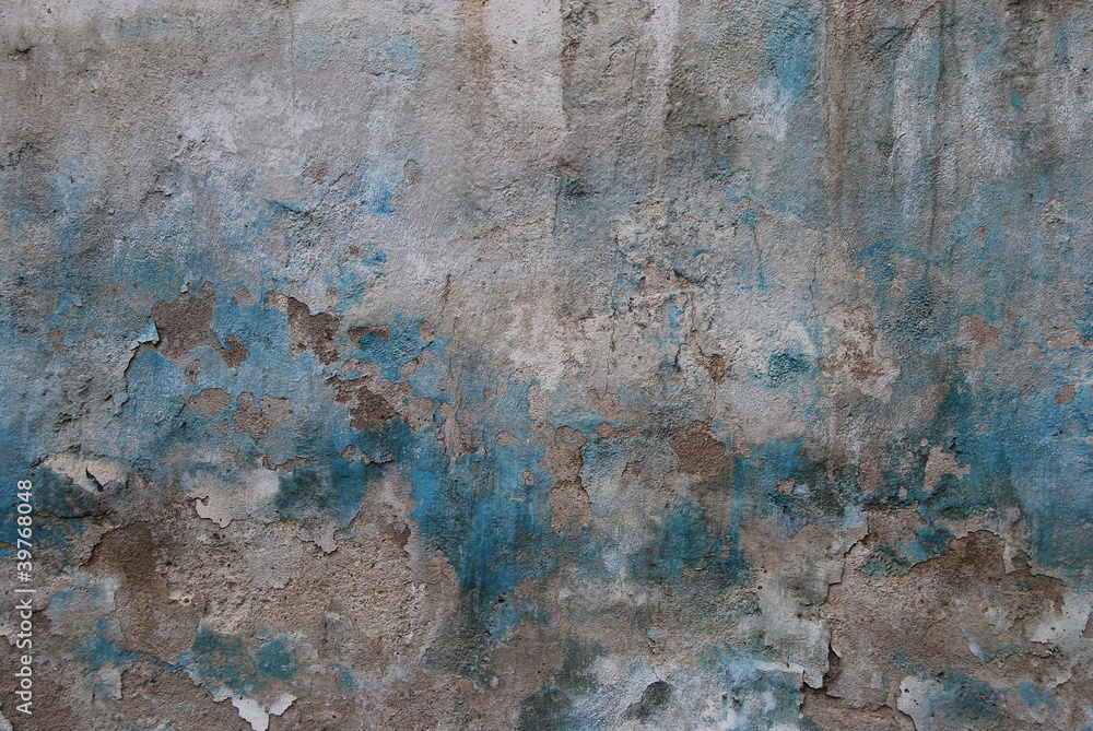 Old crumbled plastered wall faded paint as background