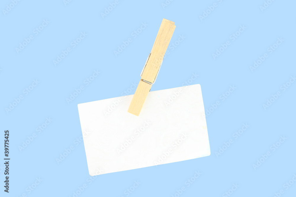 Direct paper clip wooden clothespin on blue background. Direct paper clip wooden clothespin on blue background.