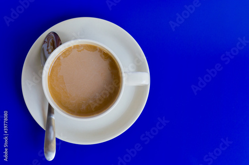 Coffee cup on blue background