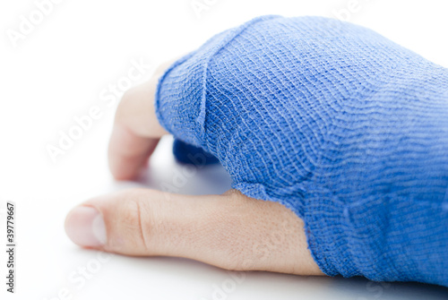 Hand bandaged in blue plaster