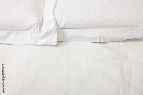 double bed with white linens