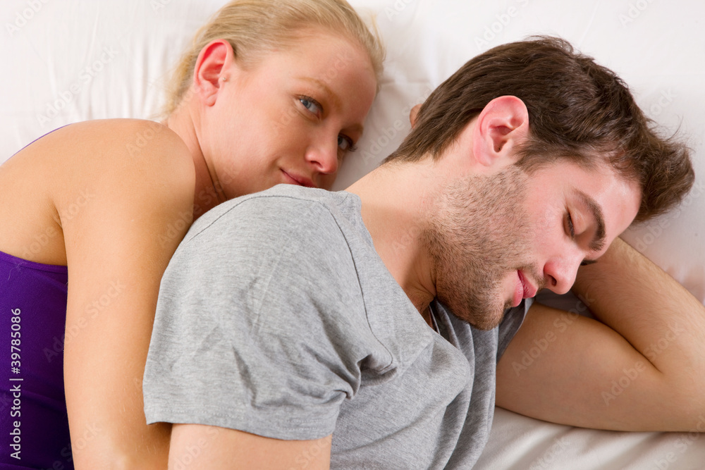 couple lying in bed couple lying in bed