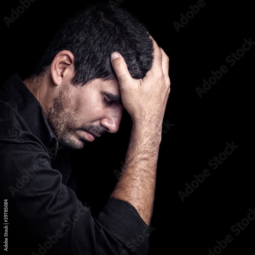 Portrait of a very sad young hispanic man