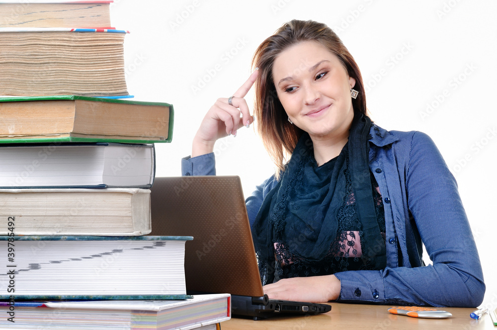 Student girl with a netbook and books Student girl with a netbook and books