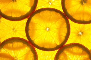 Keuken achterwand Plakjes fruit Sinaasappel plakjes macro met tegenlicht  © Taiga