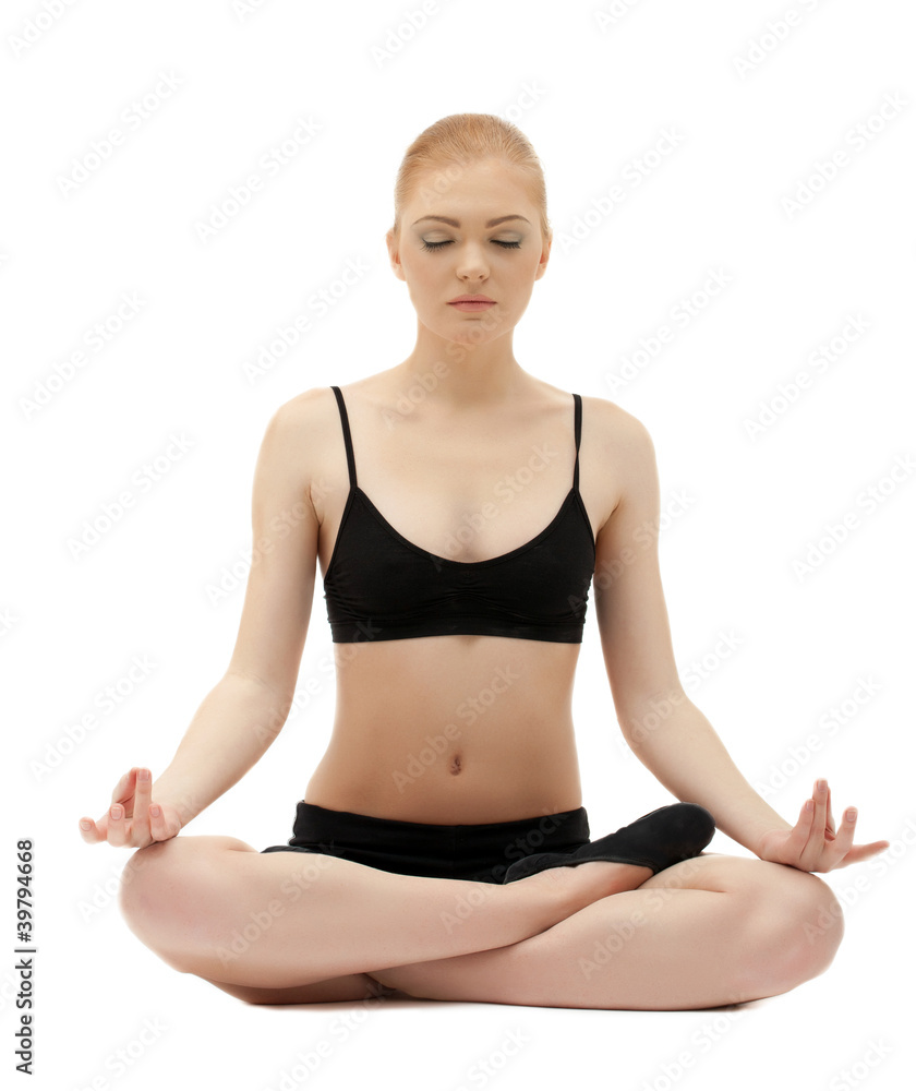 Cute blond girl sit in yoga lotos asana pose