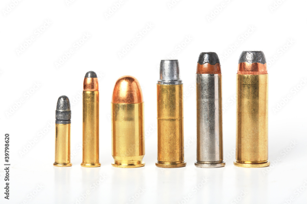 bullet- ammo size compare, isolated white. bullet- ammo size compare, isolated white.