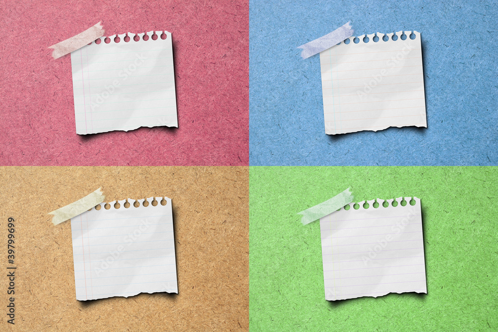 Fototapeta premium colorful note paper stick on wooden background.